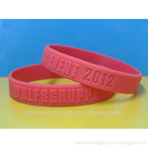 Debossed and embossed message wristbands